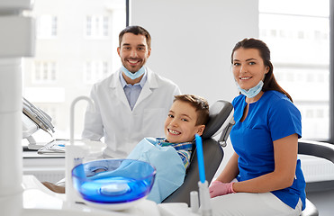 Image showing dentists and kid patient at dental clinic