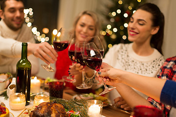 Image showing close up of friends with wine celebrate christmas