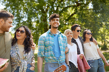 Image showing friends with guitar going to picnic at park