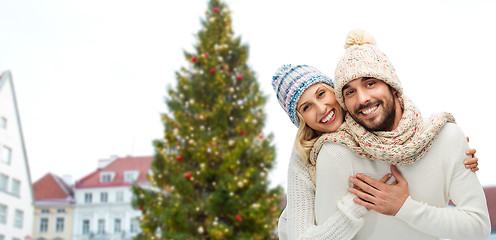 Image showing happy couple hugging over christmas tree