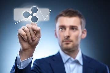 Image showing business man touches a ripple icon