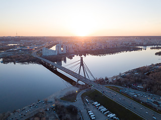 Image showing Kiev, Ukraine: 7 April, 2018 - City landscape from a bird\'s-eye view overlooking North Bridge (Moscow Bridge) across Dnieper River, photo from drone