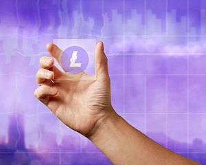 Image showing On a glass digital screen, the lithcoin icon on an ultraviolet background