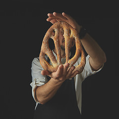 Image showing Baker holding fougas bread