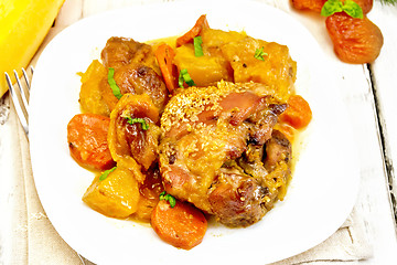 Image showing Chicken roast with pumpkin and carrots on wooden board