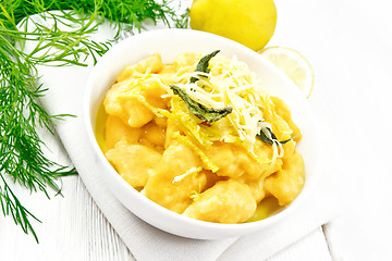 Image showing Gnocchi pumpkin with lemon in bowl on light board