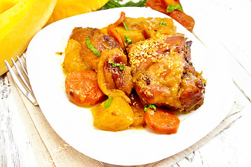 Image showing Chicken roast with pumpkin and carrots on board