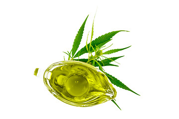 Image showing Oil hemp in sauceboat on top