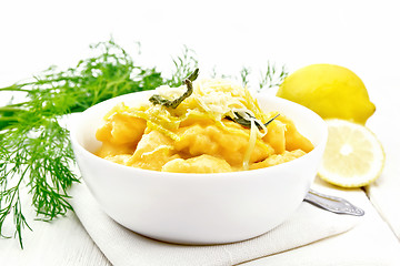 Image showing Gnocchi pumpkin with lemon in bowl on board