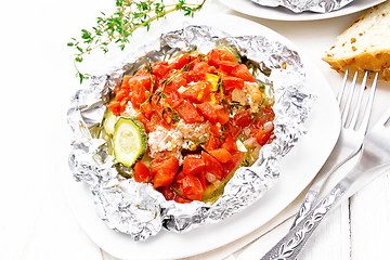 Image showing Salmon with vegetables in plate on board