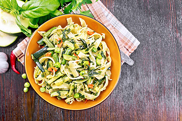 Image showing Tagliatelle with green vegetables on board top