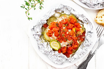 Image showing Salmon with vegetables in plate on board top