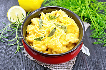 Image showing Gnocchi pumpkin in bowl on dark wooden board