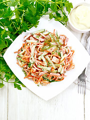 Image showing Salad of sausage and spicy carrots with mayonnaise on board top