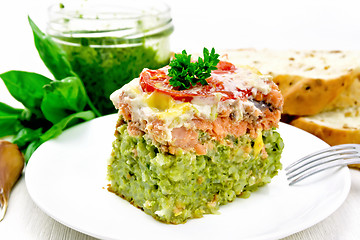 Image showing Casserole of salmon and rice on light board