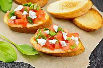 Image showing Bruschetta with tomato and cheese on table