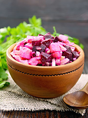 Image showing Vinaigrette in clay bowl on board