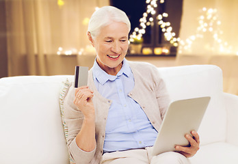 Image showing senior woman with tablet computer and credit card