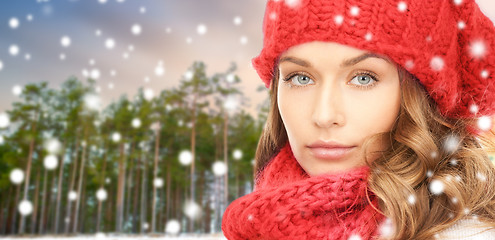 Image showing woman in hat and scarf over winter forest