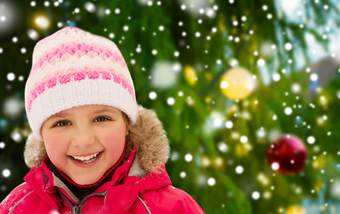 Image showing happy little girl in winter clothes outdoors
