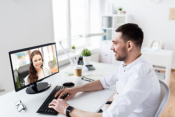 Image showing businessman having video call on pc at office