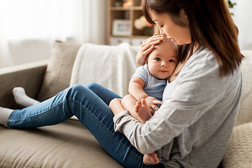 Image showing happy mother with little baby son at home