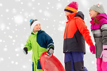 Image showing happy little kids with sleds in winter