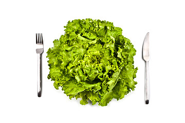 Image showing Organic green salad, fork and knife on white background. 
