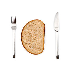 Image showing Fresh baked bread slice, fork and knife on white background. 