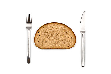 Image showing Fresh baked bread slice, fork and knife on white background.