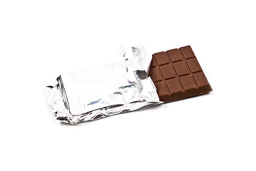 Image showing Milk chocolate bar in foil isolated on white.