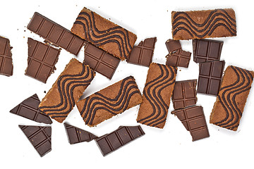 Image showing Cake bars filled with cream and cracked chocolate pieces isolate