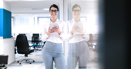 Image showing Business Woman Using Digital Tablet in front of Office