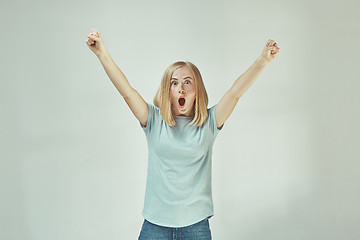 Image showing Winning success woman happy ecstatic celebrating being a winner. Dynamic energetic image of female model