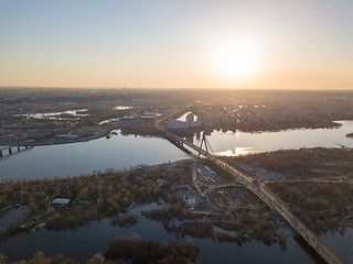 Image showing Aerial view on kiev city at sunset. The north bridge over the Dnieper River