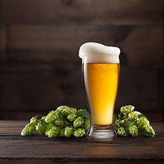 Image showing Still life with a glass of beer and hop.