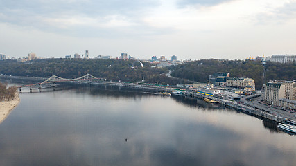 Image showing The panoramic bird\'s eye view shooting from drone of the Podol district, the right bank of the Dnieper River and centre of Kiev, Ukraine summer evening at sunset on the background of the cloudy sky.