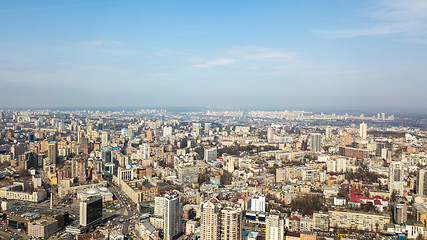 Image showing Kiev, city center, panoramic view on a sunny day against the blue sky. Photo from the drone