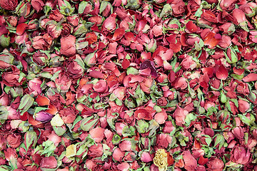 Image showing tea with dry rose petals Background