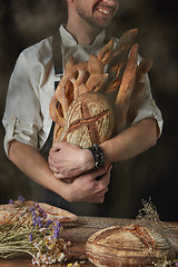 Image showing Baker keeps a variety of bread