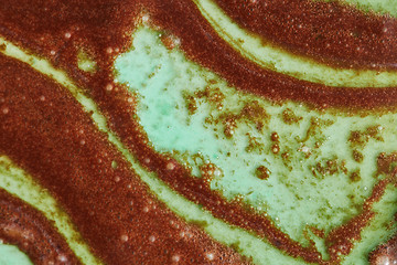 Image showing Close up of abstract background from melted chocolate and mint sorbet.
