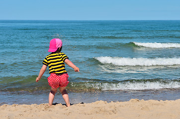 Image showing Small kid play with sand