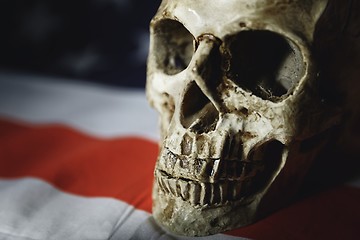 Image showing Human skull against american flag