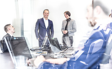 Image showing Corporate business team having informal office meeting.