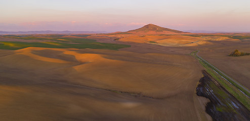 Image showing Pink Light Bathes Clouds Behind Steptoe Butte Palouse Region Sun