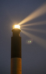 Image showing Oak Island Lighthouse Beams into the Seafoam at Fort Caswell