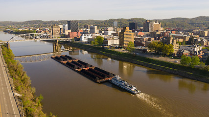 Image showing Barge Pushes Resources Down the River in Front of Charleston Wes