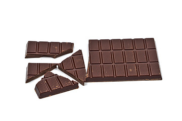 Image showing Broken dark chocolate bar isolated on white.