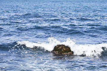 Image showing Waving water surface and stone of the Adriatic sea.