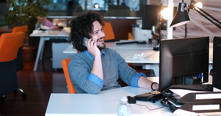 Image showing businessman working using a computer in startup office